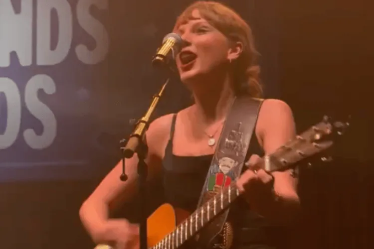 Taylor Swift surprises fans with a live “Shake It Off” performance at Nashville’s Tight End University charity event.
