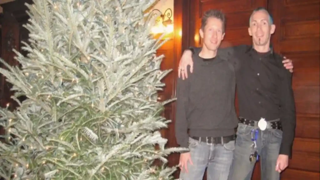 Joey Banis (right) and Jeffrey Mundt in front of their Christmas tree months after the murder of Jamie Carroll for 'Murder in Glitterball City.'