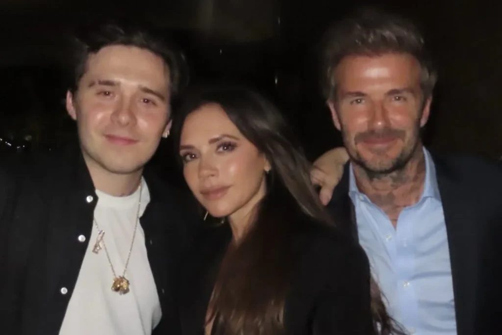 Brooklyn with his parents Victoria and David Beckham.
